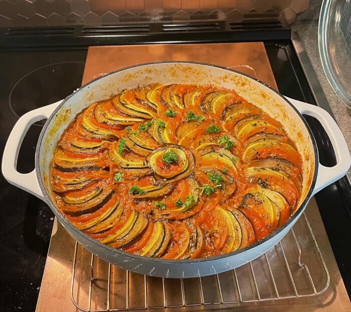 Colorful baked vegetable dish in a round pan, showcasing main character splurges during Black Friday week sales.