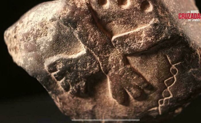 Close-up of an ancient carved stone artifact showcasing archeology discovery with detailed engravings and textures.