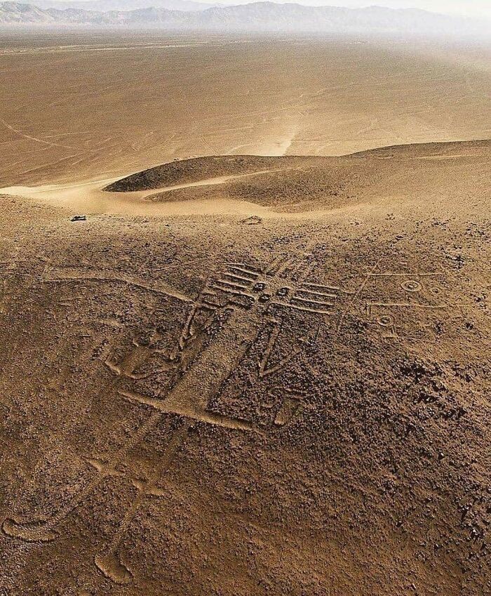 Aerial view of ancient Nazca Lines geoglyph in desert, a fascinating archeology find from around the world.