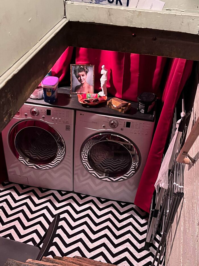 Laundry area in a beautiful old house featuring craftsmanship details and a patterned black and white floor design.