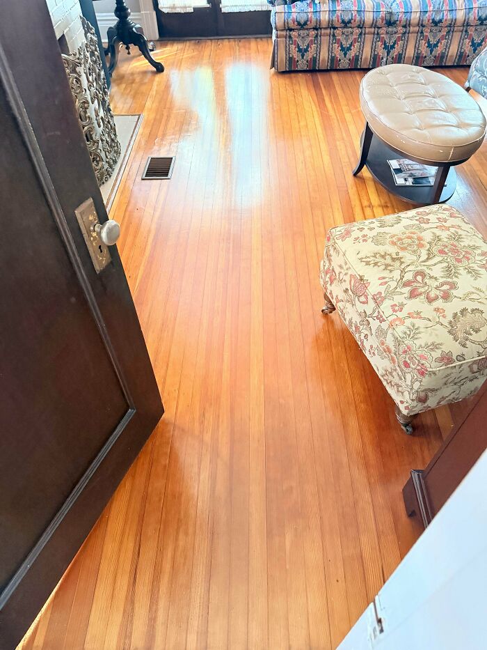 Polished hardwood floor and vintage furniture in a beautiful old house showcasing traditional craftsmanship.