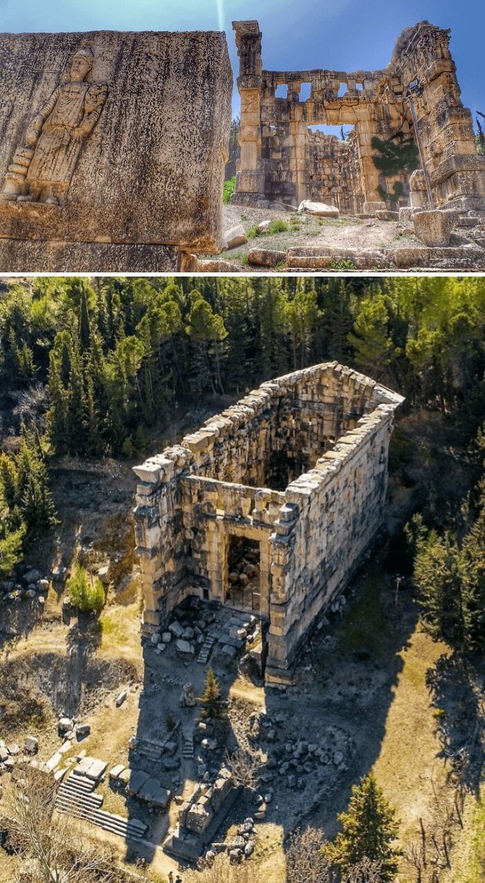 Ancient archeology ruins with carved stone reliefs and a partially standing rectangular stone structure in a forest clearing.