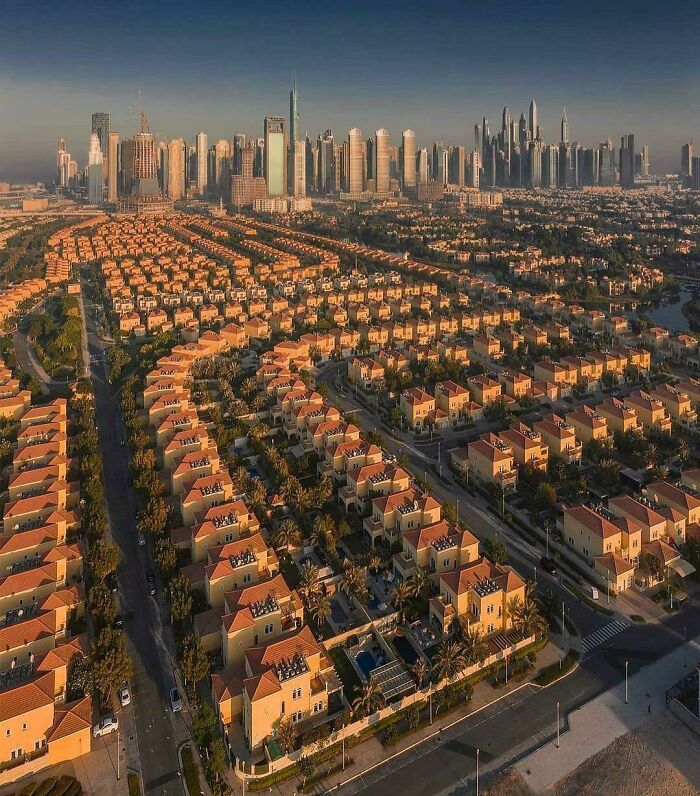 Aerial view of a sprawling residential area with high-rise buildings in the background, reflecting Miami cityscape.