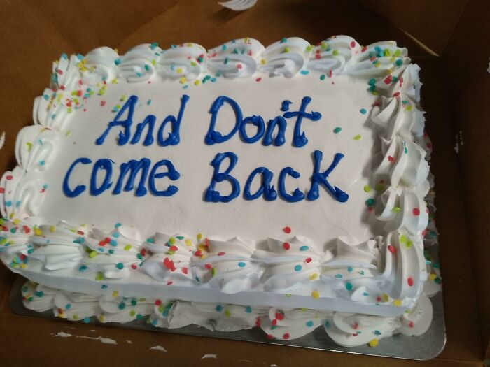 Cake with white frosting and colorful sprinkles, decorated with a prank message telling employees not to come back.