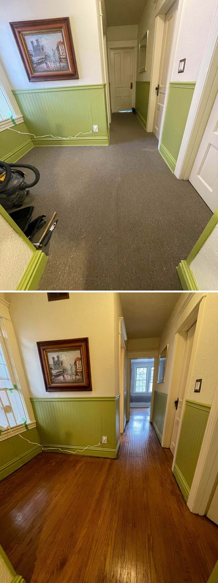 Old house hallway showing craftsmanship with wood flooring, green wainscoting, and vintage doors in a historic home.