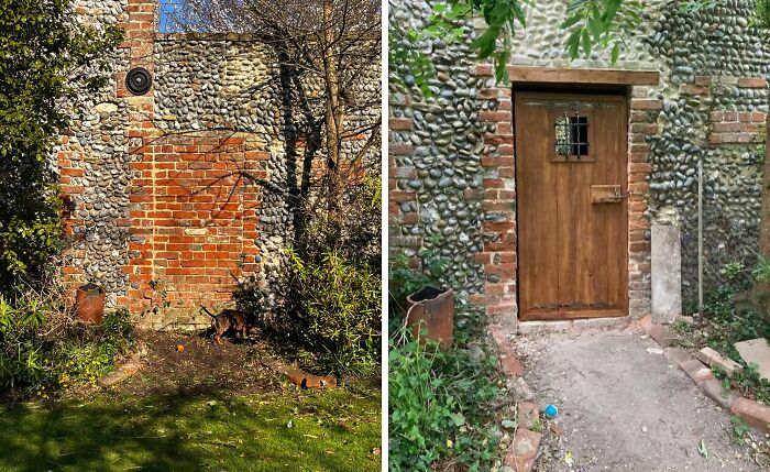 Old house exterior wall with flint and brick craftsmanship, showing a wooden door and garden surroundings in natural light.