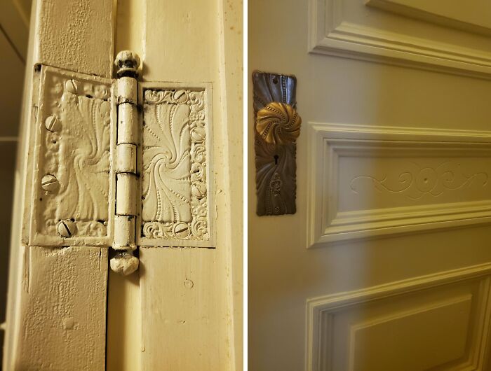 Close-up of beautiful old houses showcasing detailed craftsmanship on door hinge and antique door handle.