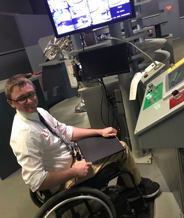 Man in a wheelchair working with advanced technology equipment, showcasing how people turn big and small dreams into reality.