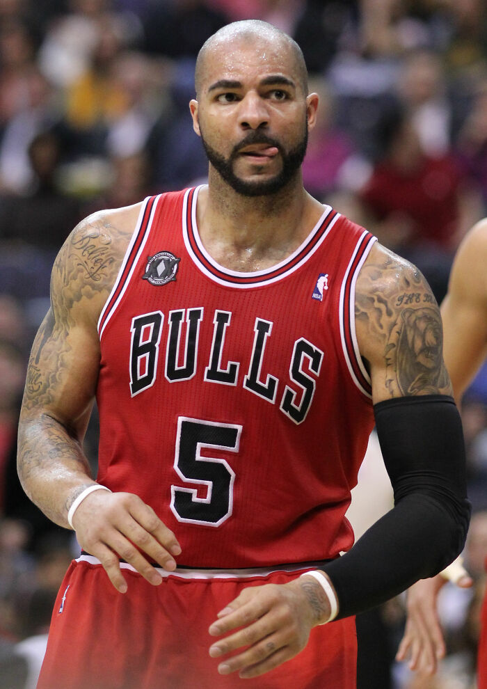 Carlos Boozer in Chicago Bulls jersey number 5 during a basketball game with focused expression on court.