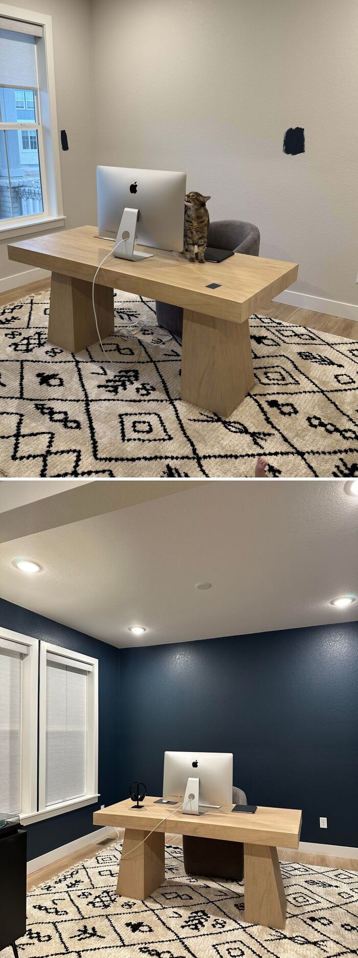 Modern home office setup with wooden desk, patterned rug, and neutral to dark blue wall decor inspiration.