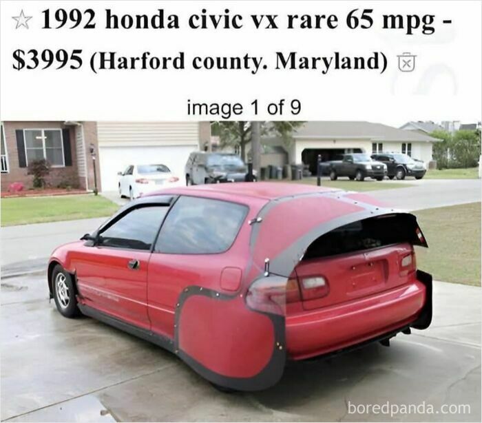 Red 1992 Honda Civic with unusual black custom rear and side modifications seen in suburban driveway, curiosity of car customization fails.