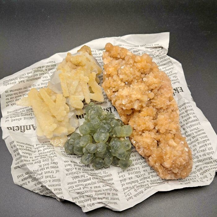 Various forbidden foods displayed on crumpled newspaper, highlighting unusual textures and colors to resist eating.