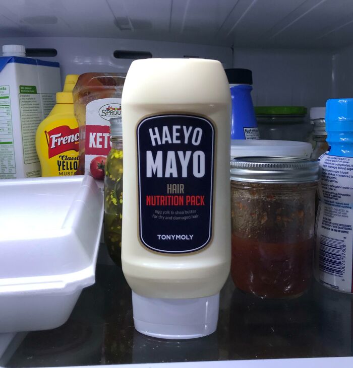 Bottle of Haeyo Mayo hair nutrition pack inside a fridge among condiments, highlighting the concept of forbidden foods.