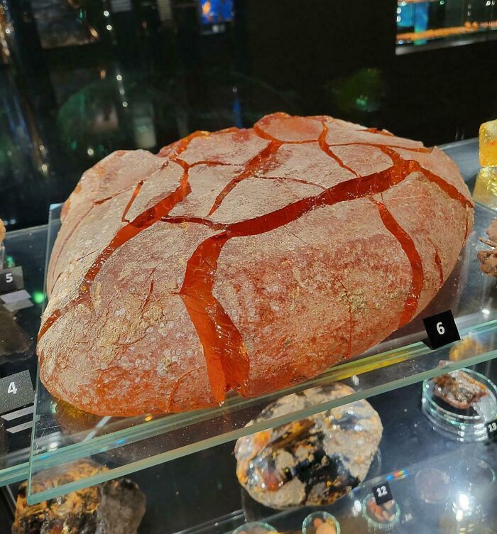 Close-up of a large c*****d red stone resembling forbidden foods that you should resist eating for your own good.