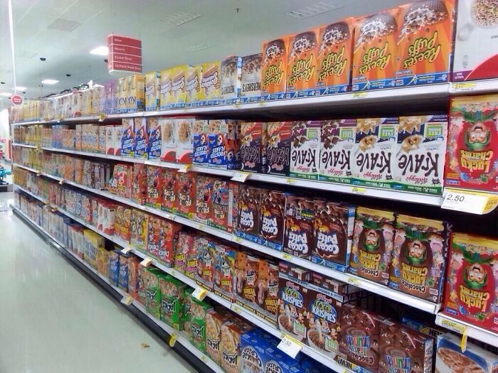 Grocery store cereal aisle with prank of upside down cereal boxes as a joke by employees showing zero regrets.