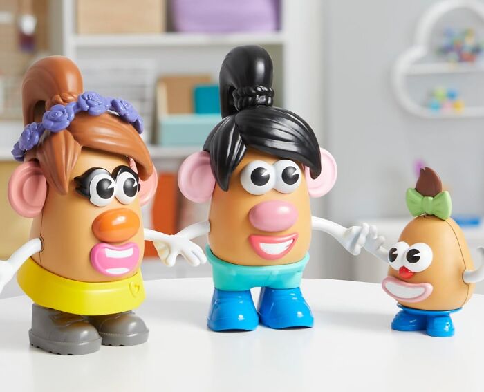 Three colorful kids toys resembling Mr. Potato Head characters on a white table, promoting Black Friday deals on kids toys.