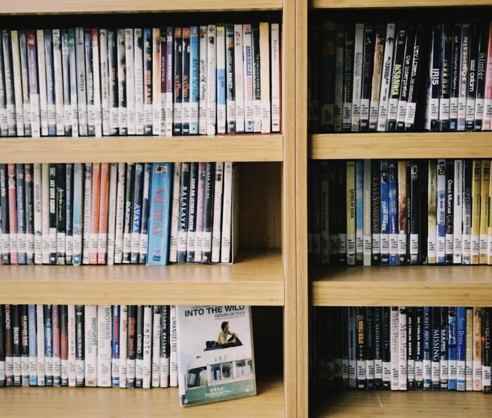 Shelves filled with DVDs, emphasizing a collection that could inspire stories of petty revenge on an ex with zero regrets.