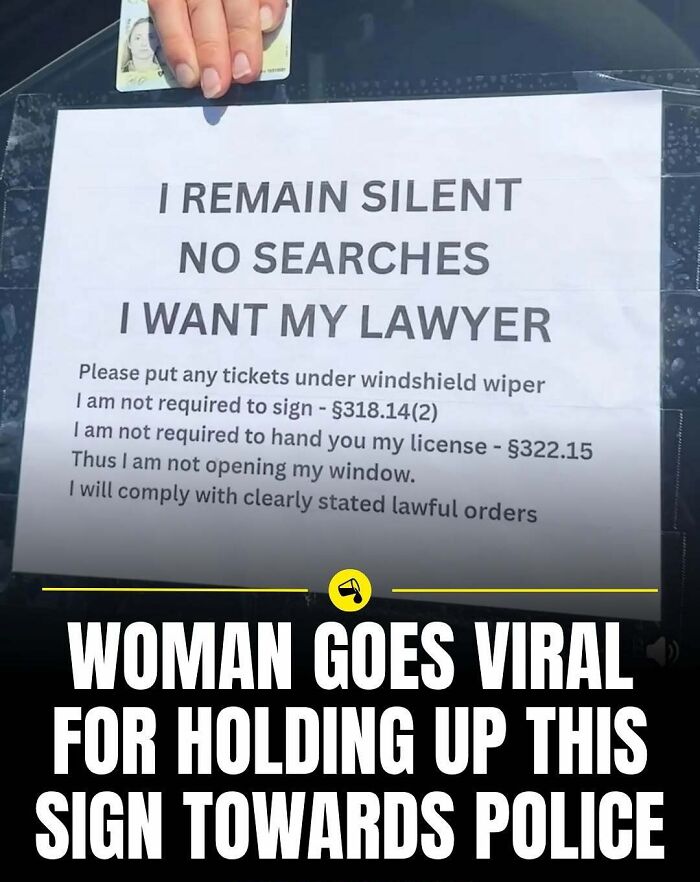 Person holding a sign stating legal rights and lawyer request, featured in viral photos from Spill Now collection.