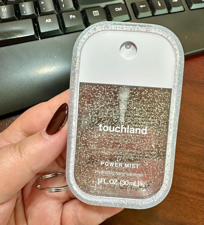 Compact touchland hand sanitizer with glitter design, a pretty and practical gift for aesthetic personality friends.