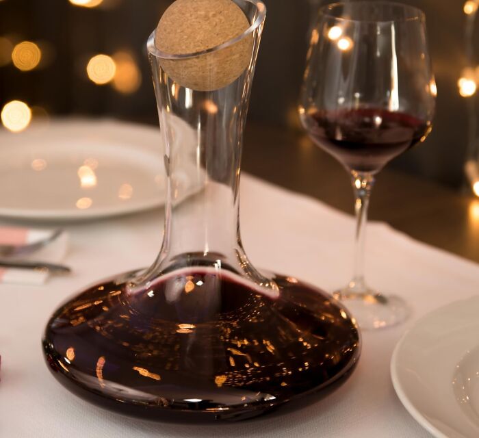 Elegant wine decanter and glass on a table, perfect aesthetic gift for friends who appreciate stylish and practical items.
