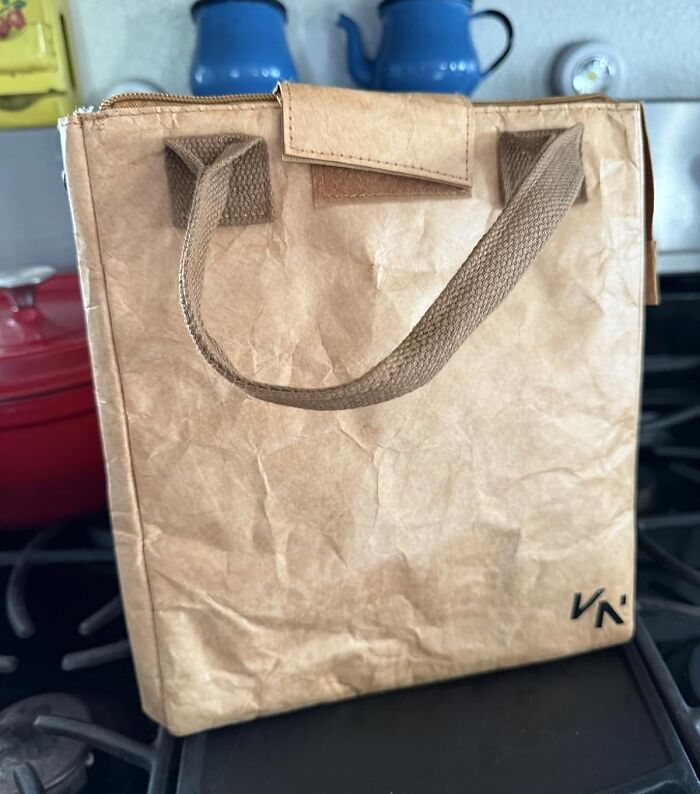 Brown reusable tote bag with fabric handles, shown on a kitchen stove as an aesthetic gift idea.