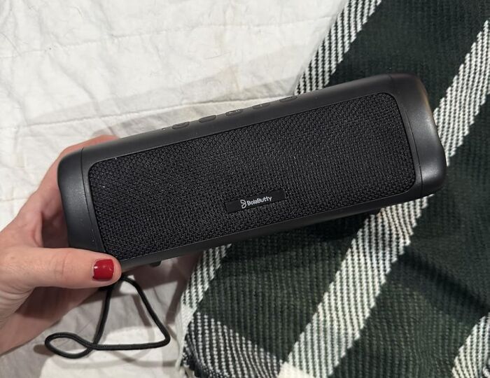 Portable Bluetooth speaker held in hand showcasing one of the Black Friday deals you can still snag this season.