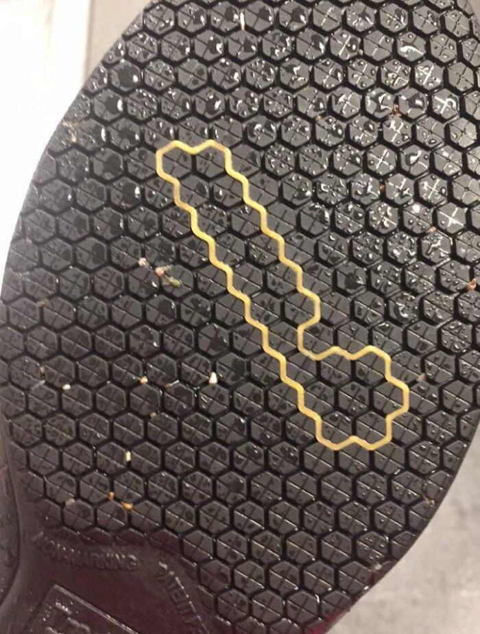 Perfectly aligned rubber band matching the hexagon pattern on a shoe sole, showcasing things aligned so perfectly.