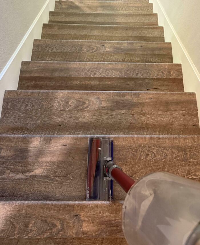 Vacuum aligned perfectly with the wood pattern on a staircase creating a seamless visual effect.