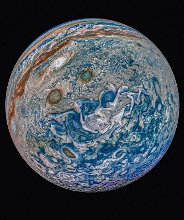 Swirling storms on the planet Jupiter, showcasing complex patterns related to existence, reality, and the universe's mysteries.