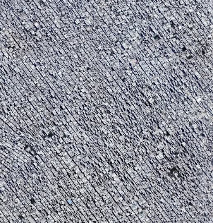 Aerial view of a densely packed cityscape illustrating the complexity of existence, reality, and the universe.