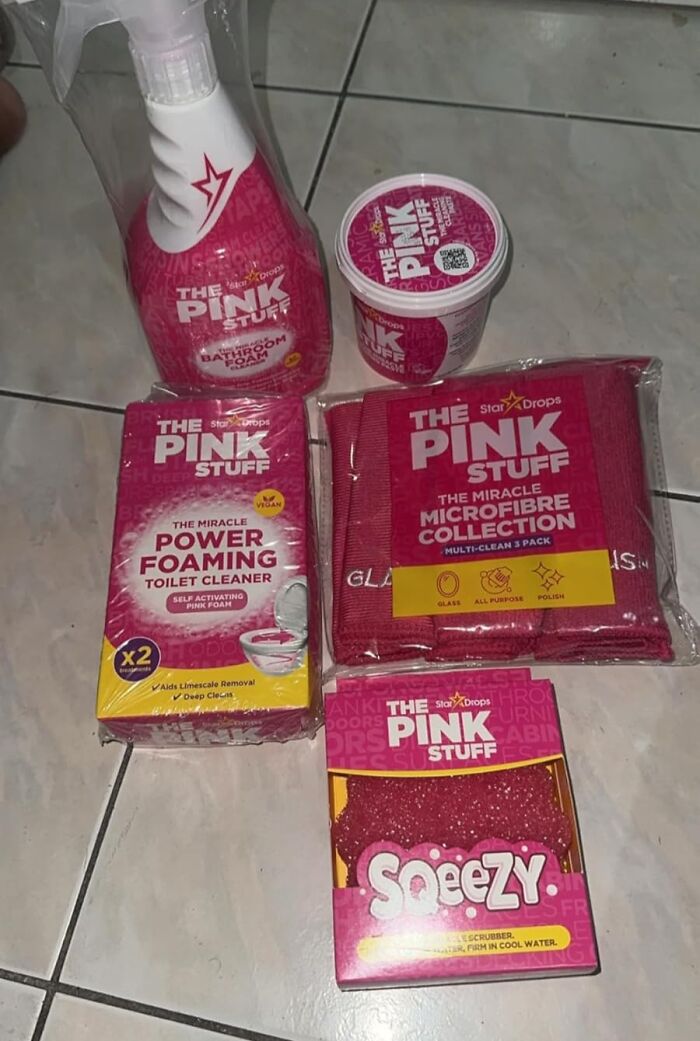 Various Pink Stuff cleaning products displayed on tile floor as part of Cyber Monday deals trending this year.
