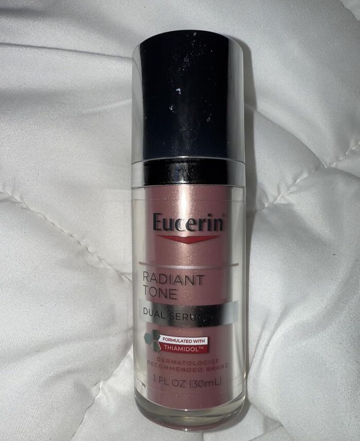 Eucerin Radiant Tone dual serum bottle on white fabric showcasing top Cyber Monday deals.