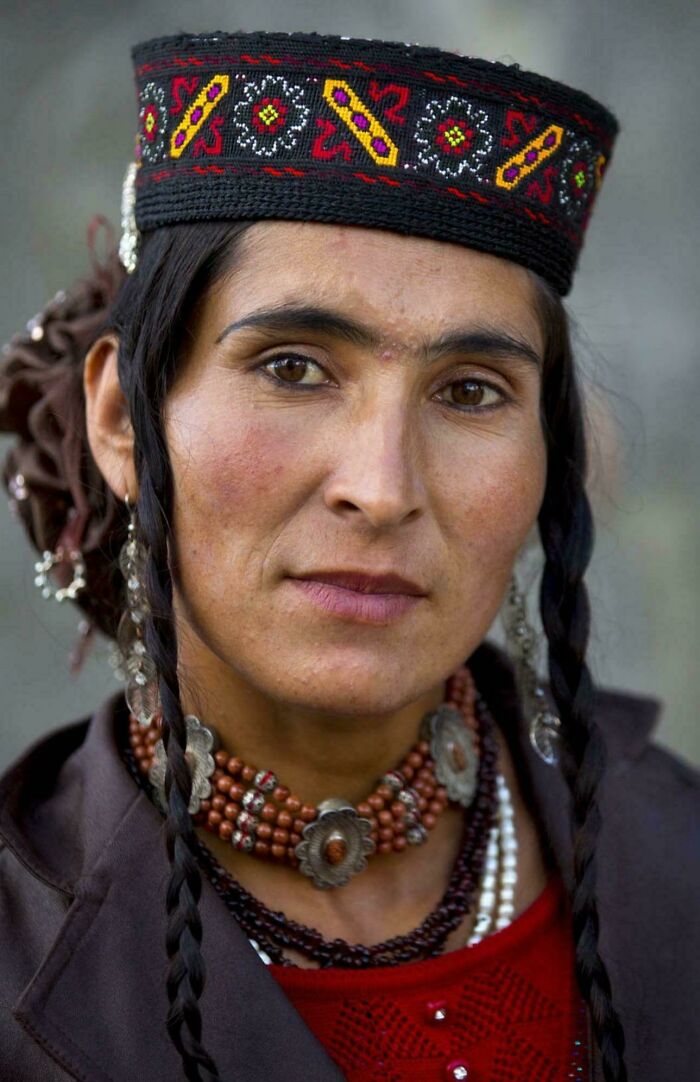 Portrait of a woman wearing traditional attire and jewelry, capturing the beauty, strength, and diversity of humans.