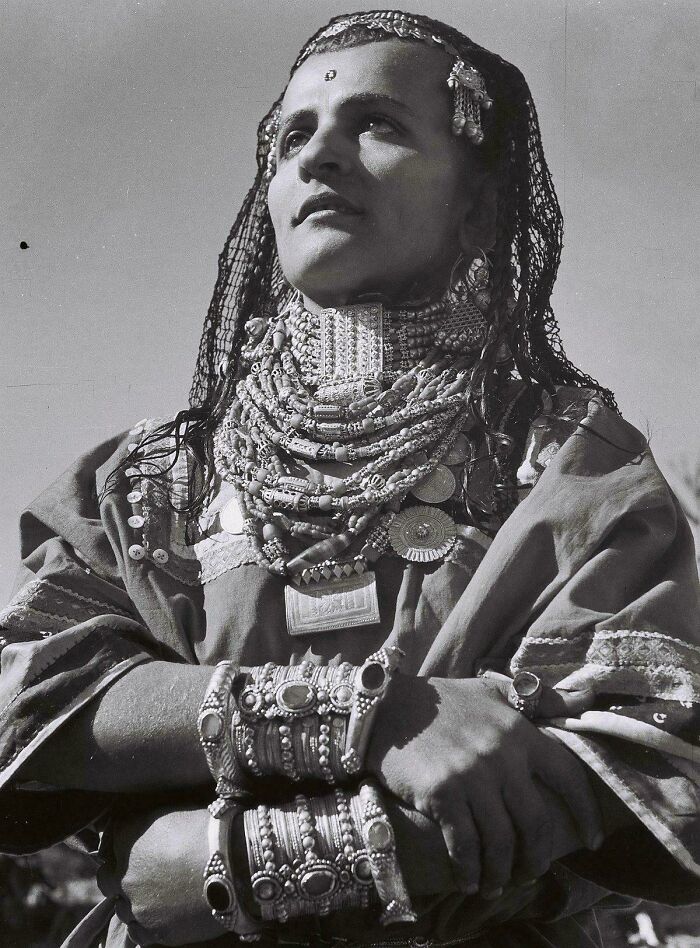 Black and white portrait of a woman wearing traditional jewelry and clothing, capturing beauty, strength, and diversity.