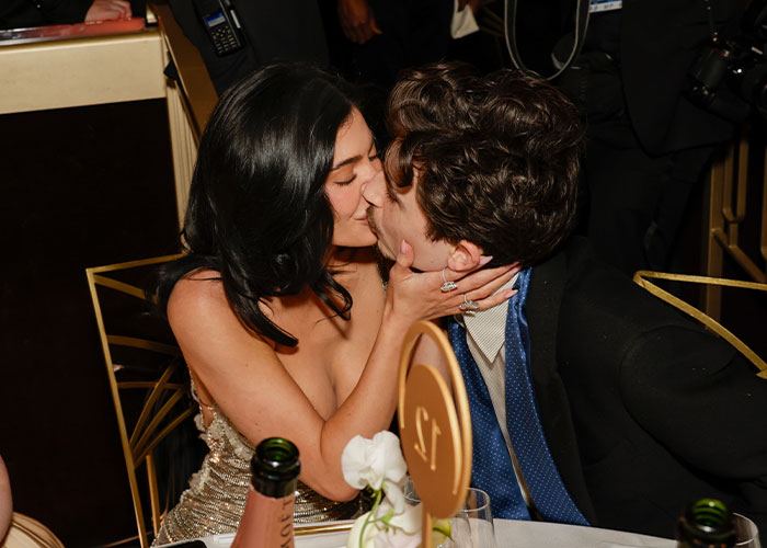 Timothée Chalamet kissing a woman at a formal event, sparking backlash over his comments about having kids. Timothée Chalamet kissing a woman at a formal event, sparking backlash over his comments about having kids.