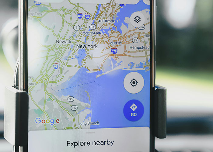 Smartphone displaying a navigation app map, highlighting life hacks related to directions and exploring nearby places.