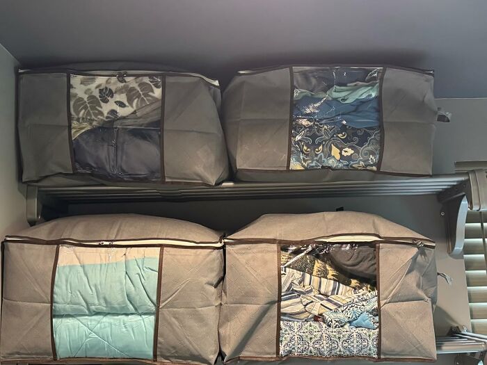 Closet storage bags filled with clothes showcasing organized home storage deals for Cyber Monday weekend steals.