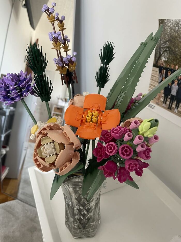 LEGO flower bouquet arranged in a clear vase, a creative gift idea for people who are impossible to shop for.