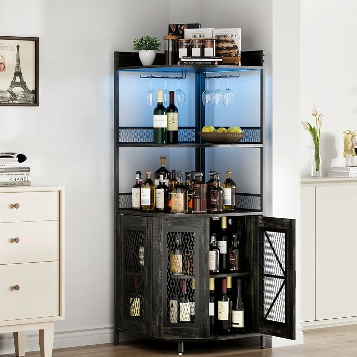 Black kitchen storage cabinet with wine bottles, glasses, and decorative items, ideal for Black Friday kitchen deals.