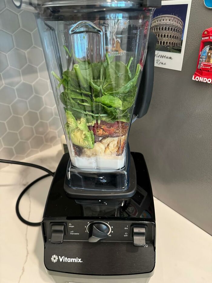 Vitamix blender filled with fresh ingredients on countertop, highlighting Black Friday week hot deals for kitchen appliances.