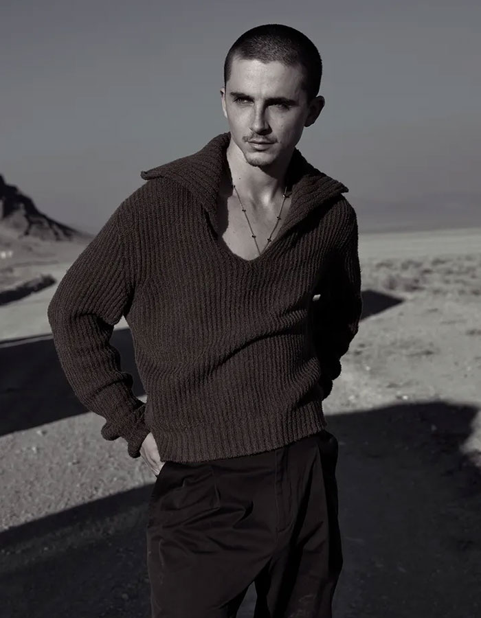 Timothée Chalamet standing outdoors in a textured sweater, sparking backlash over his comments about having kids. Timothée Chalamet standing outdoors in a textured sweater, sparking backlash over his comments about having kids.