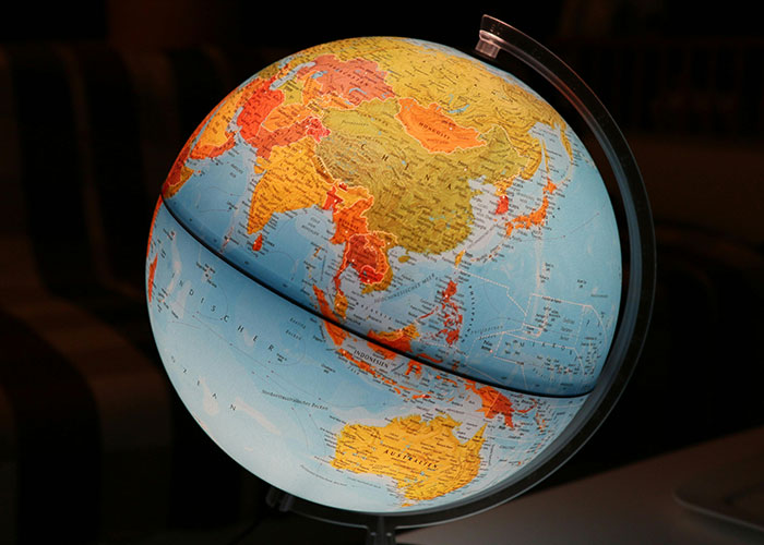 Globe showing Asia and Australia in warm colors, illustrating pieces of common knowledge that surprise many people.