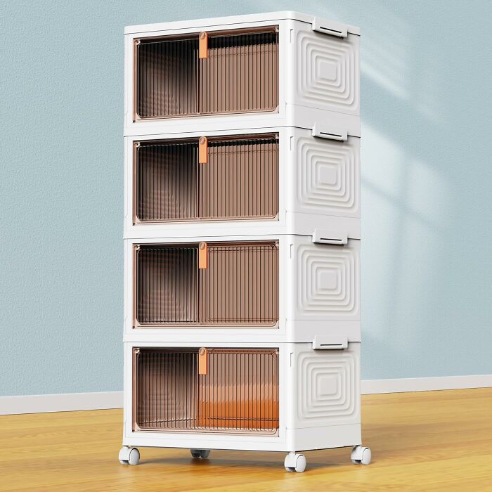 Stacked modern storage drawers with translucent brown fronts on wheels in a bright room, showcasing 11.11 deals on home organization.