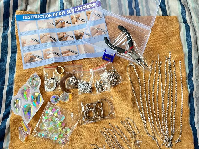 DIY sun catcher supplies and tools laid out for a hands-on hobby during hibernation season to keep busy and creative.