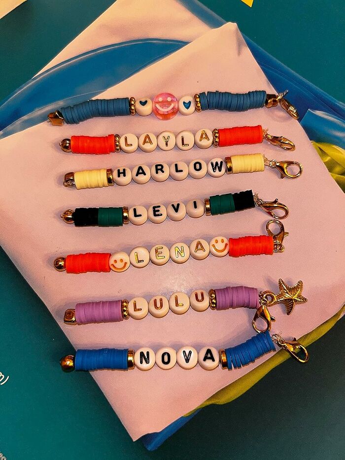 Colorful handmade beaded keychains with names, showcasing a creative hobby to keep hands busy during hibernation season.