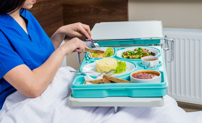 Pregnant woman eating hospital meal prepared by clueless dads showing lovable things during pregnancy.