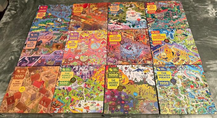 A collection of colorful 1000-piece puzzles laid out, perfect hobbies to keep your hands busy during hibernation season.