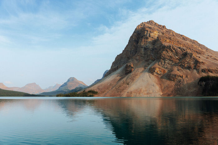 Mountain landscape reflected in calm lake water, symbolizing a journey to find purpose and clarity.