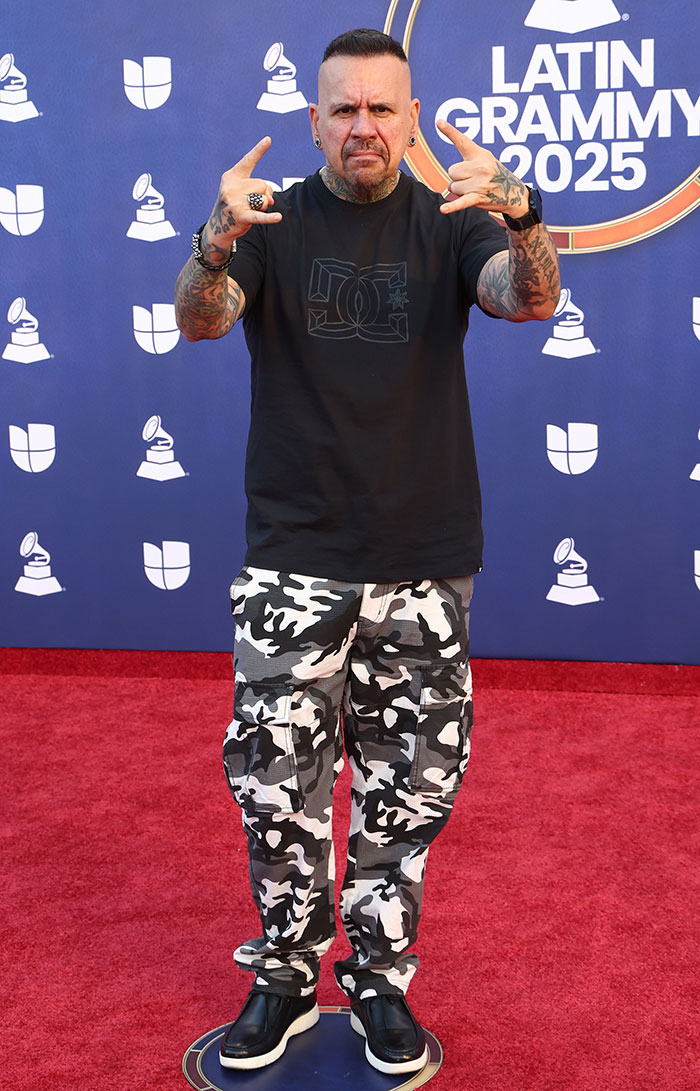 Male star at the 2025 Latin Grammy Awards wearing black shirt and camo pants, showcasing one of the worst dressed looks.