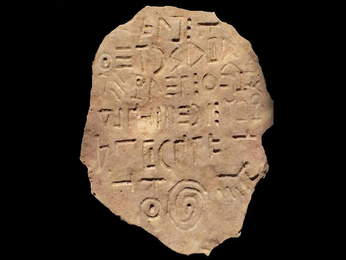 Ancient inscribed artifact featuring mysterious symbols and carvings representing fascinating archeology finds from around the world.